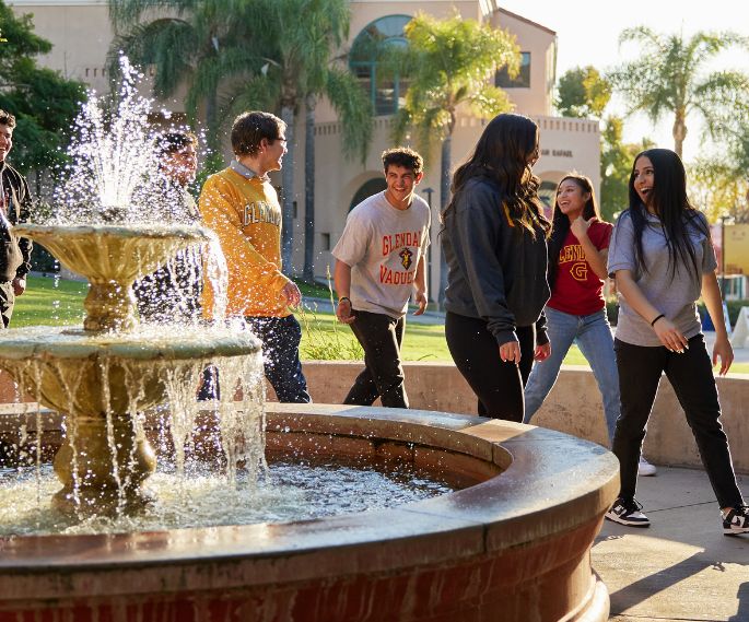GCC students walking by the fountain.